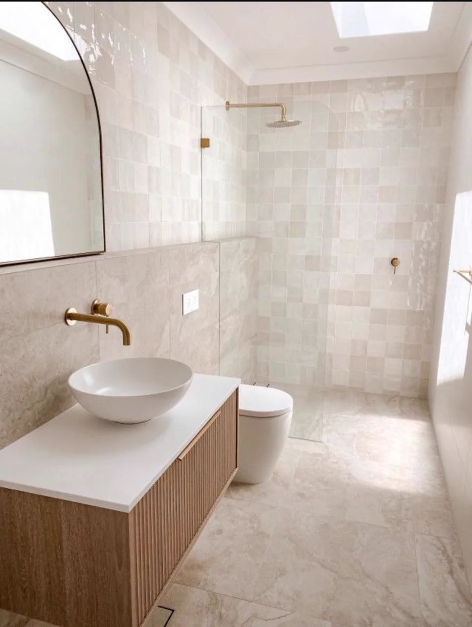 Bright neutral bathroom with a floating timber vanity, vessel basin and walk-in shower