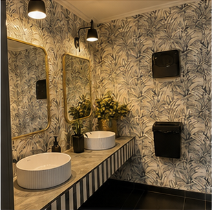 Signature Bathrooms botanical wallpaper powder room with vanity and mirror