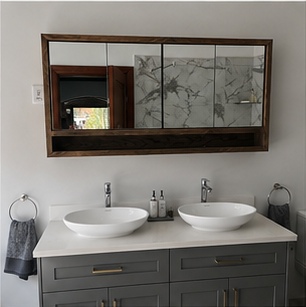 Double vanity with framed bathroom mirrors