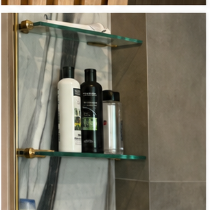 Glass shower shelf and niche detail