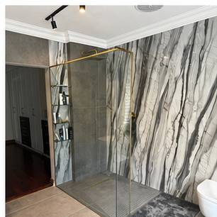 Large porcelain bathroom wall planned as a continuous surface