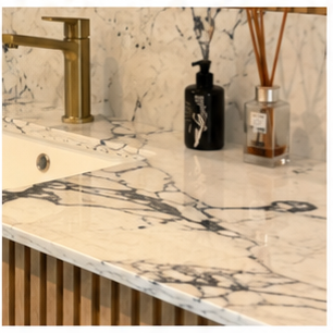 Marble bathroom surface showing the relationship between tile and joint colour