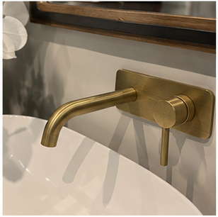 Decorative brass basin mixer in a luxury bathroom